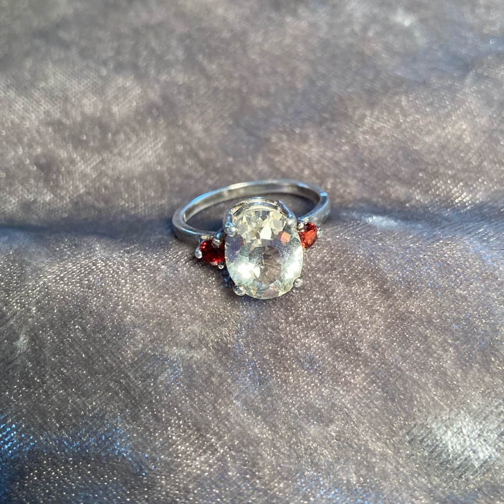 Yellow gemstone and garnet ring